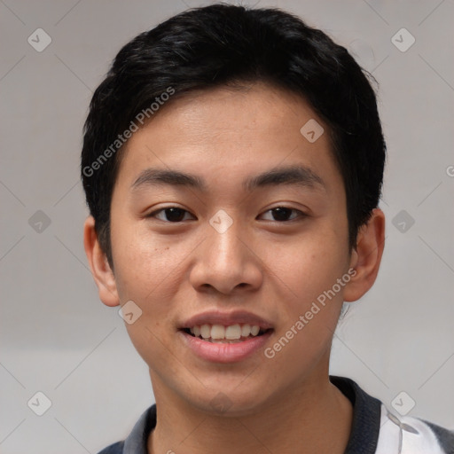 Joyful asian young-adult male with short  black hair and brown eyes