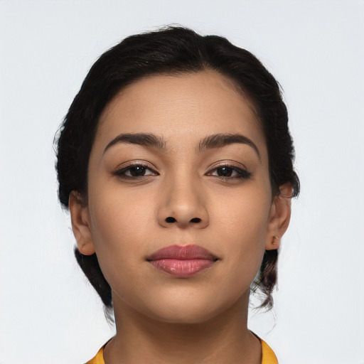 Joyful latino young-adult female with medium  brown hair and brown eyes