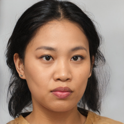 Joyful asian young-adult female with medium  brown hair and brown eyes