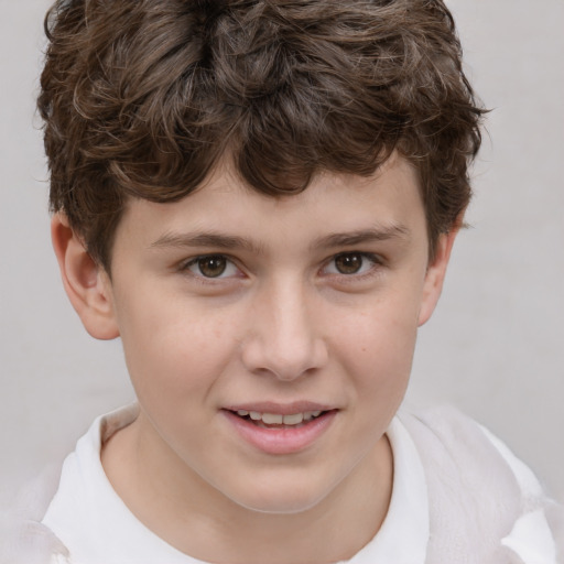 Joyful white child male with short  brown hair and brown eyes