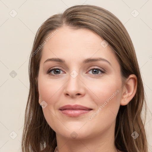 Joyful white young-adult female with long  brown hair and grey eyes