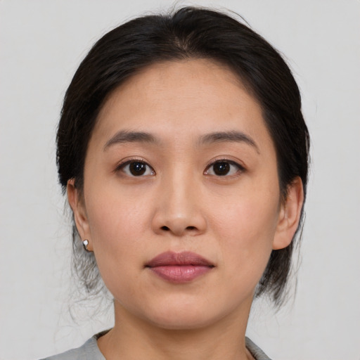 Neutral white young-adult female with medium  brown hair and brown eyes