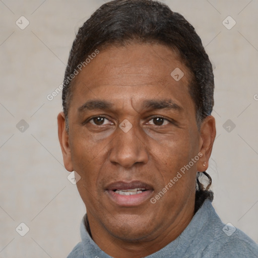 Joyful black adult male with short  black hair and brown eyes
