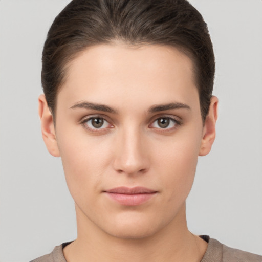 Neutral white young-adult female with short  brown hair and brown eyes