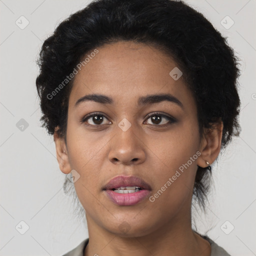 Joyful latino young-adult female with short  black hair and brown eyes