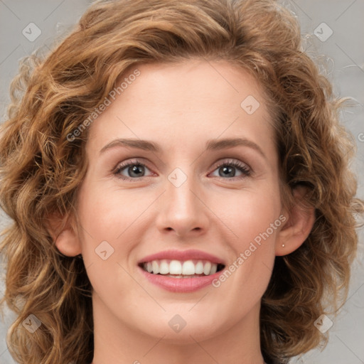 Joyful white young-adult female with long  brown hair and green eyes