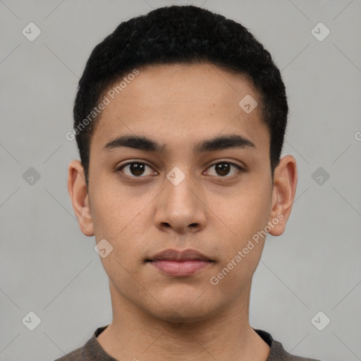 Neutral latino young-adult male with short  black hair and brown eyes