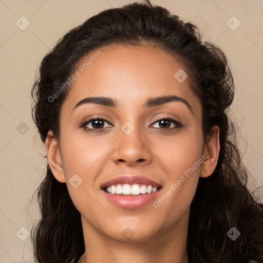 Joyful latino young-adult female with long  brown hair and brown eyes