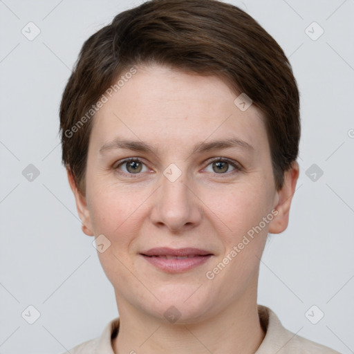 Joyful white young-adult female with short  brown hair and grey eyes