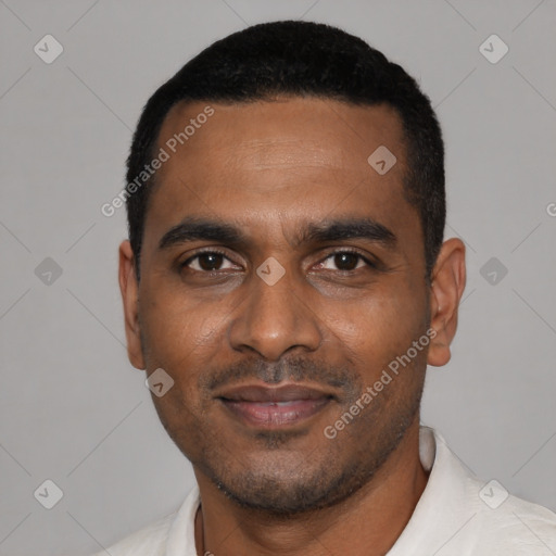 Joyful black young-adult male with short  black hair and brown eyes