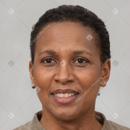 Joyful latino adult female with short  brown hair and brown eyes