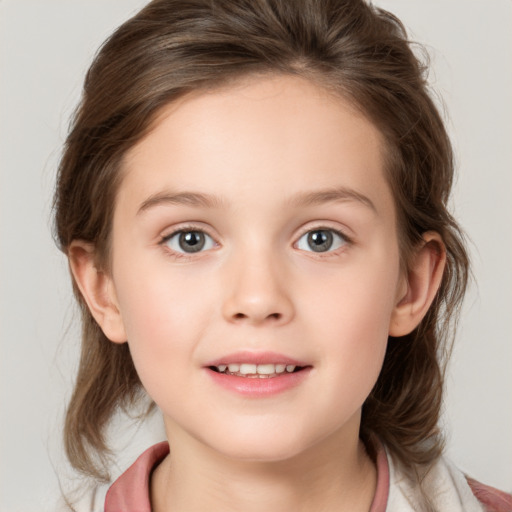 Joyful white child female with medium  brown hair and grey eyes