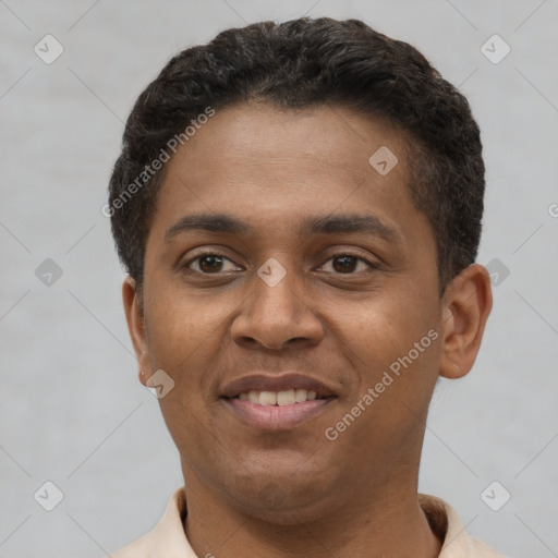 Joyful latino young-adult male with short  brown hair and brown eyes