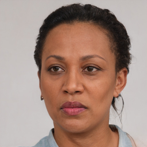 Neutral black adult female with short  black hair and brown eyes