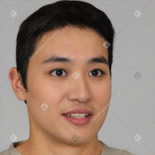 Joyful asian young-adult male with short  brown hair and brown eyes