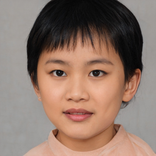 Joyful asian child female with medium  brown hair and brown eyes