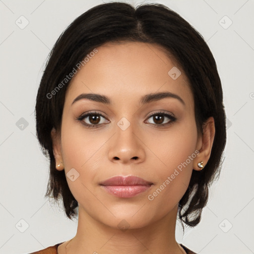 Joyful latino young-adult female with medium  brown hair and brown eyes