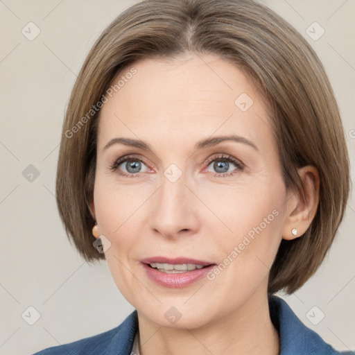 Joyful white adult female with medium  brown hair and grey eyes