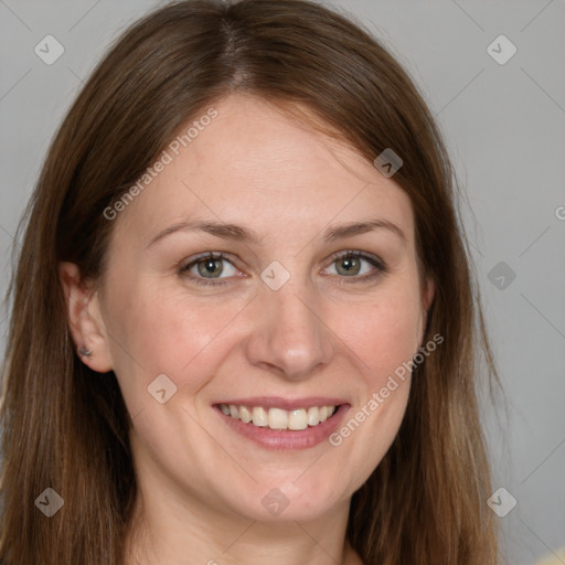 Joyful white adult female with long  brown hair and grey eyes