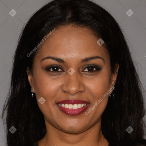 Joyful black young-adult female with long  brown hair and brown eyes