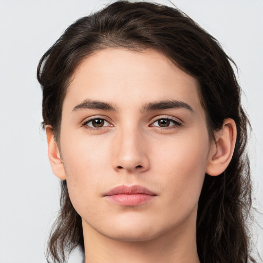 Neutral white young-adult female with long  brown hair and brown eyes