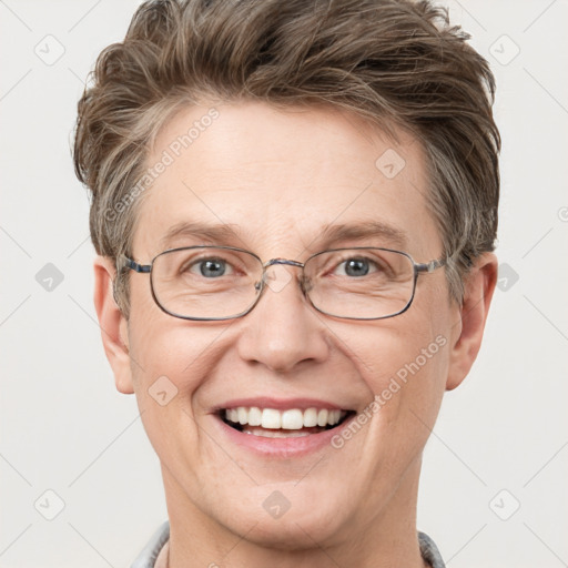 Joyful white adult male with short  brown hair and grey eyes