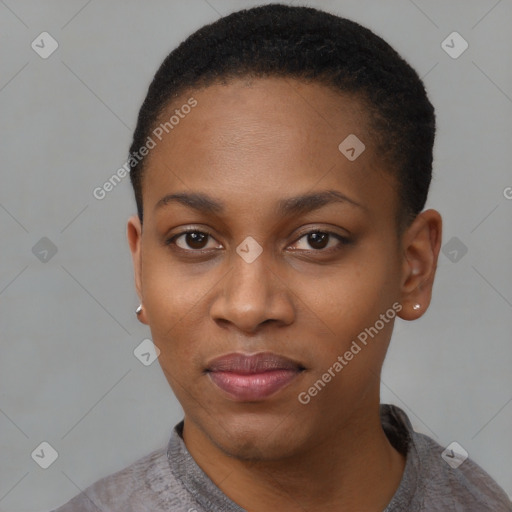 Joyful black young-adult female with short  black hair and brown eyes