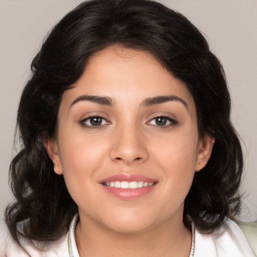 Joyful white young-adult female with medium  brown hair and brown eyes