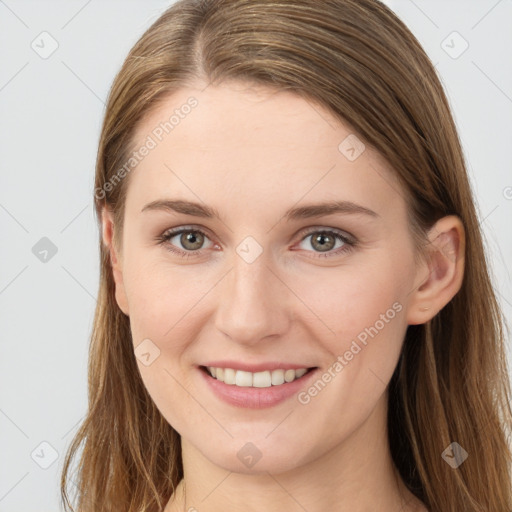 Joyful white young-adult female with long  brown hair and grey eyes