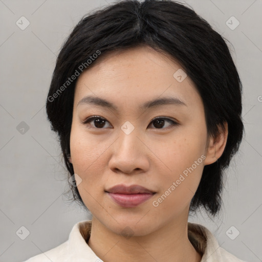 Joyful asian young-adult female with medium  black hair and brown eyes