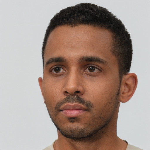 Neutral black young-adult male with short  black hair and brown eyes