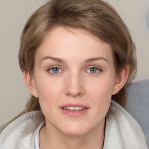 Joyful white young-adult female with medium  brown hair and blue eyes