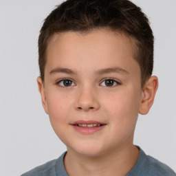 Joyful white child male with short  brown hair and brown eyes