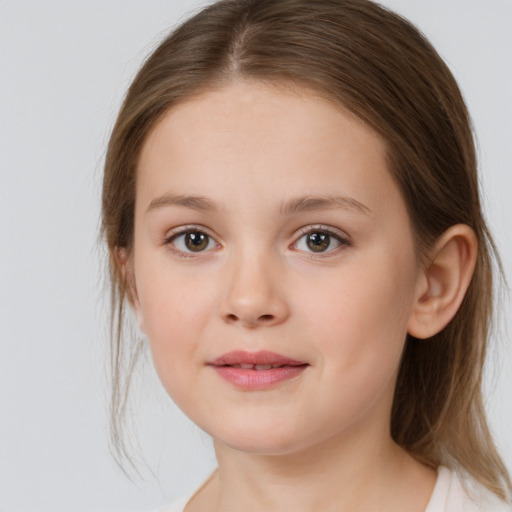 Joyful white child female with medium  brown hair and brown eyes