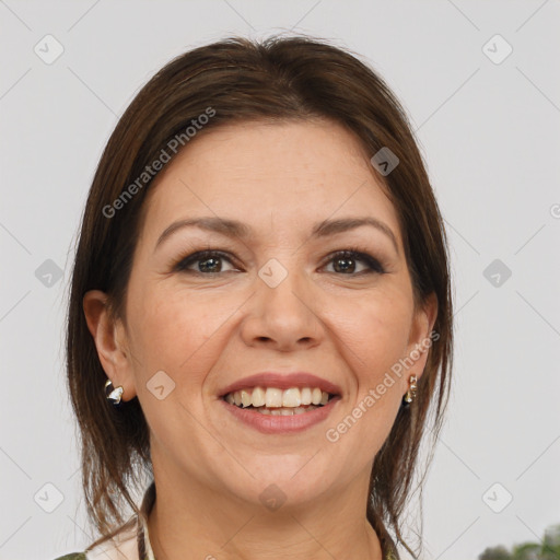 Joyful white adult female with medium  brown hair and brown eyes