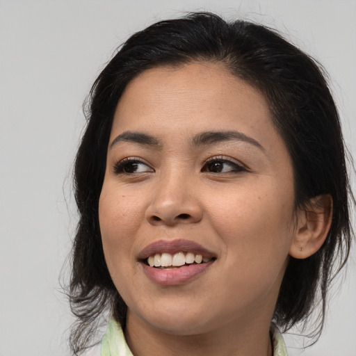 Joyful white young-adult female with medium  brown hair and brown eyes