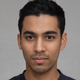 Neutral latino young-adult male with short  black hair and brown eyes