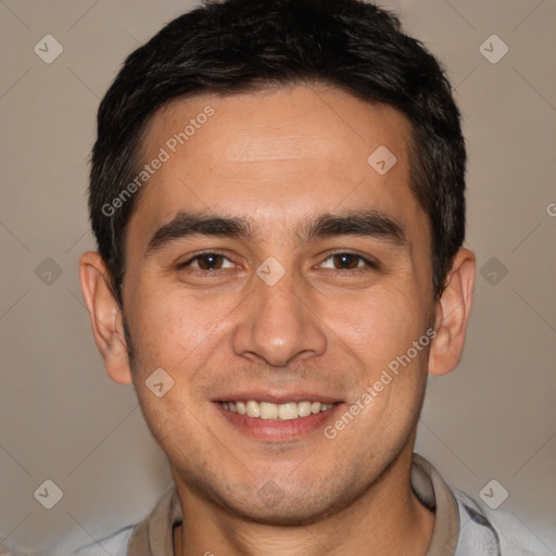 Joyful white young-adult male with short  black hair and brown eyes