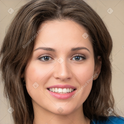 Joyful white young-adult female with medium  brown hair and green eyes