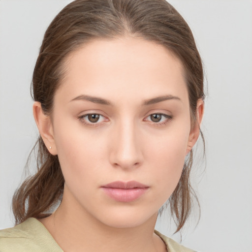 Neutral white young-adult female with medium  brown hair and brown eyes