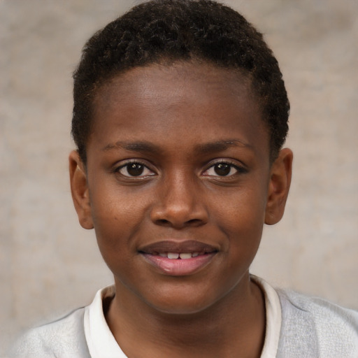 Joyful black child female with short  brown hair and brown eyes