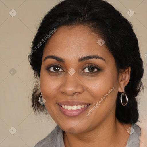 Joyful latino young-adult female with long  brown hair and brown eyes