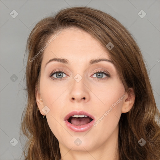 Joyful white young-adult female with medium  brown hair and green eyes