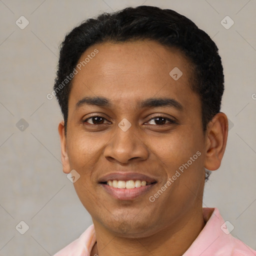 Joyful latino young-adult male with short  black hair and brown eyes