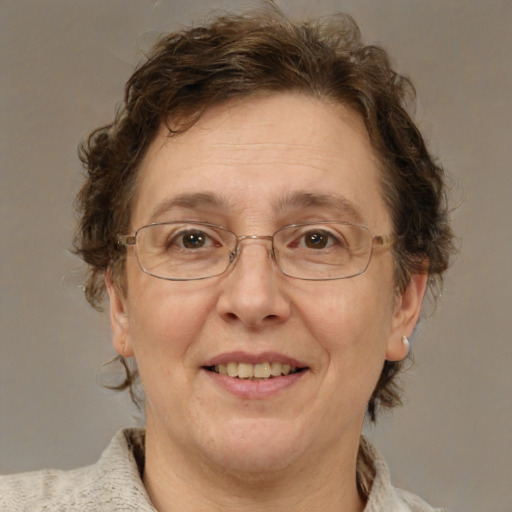 Joyful white middle-aged female with medium  brown hair and blue eyes