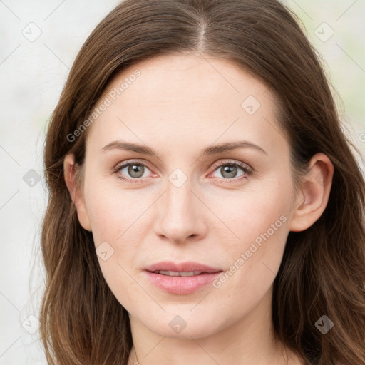 Joyful white young-adult female with long  brown hair and blue eyes