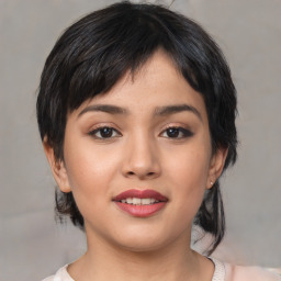 Joyful asian young-adult female with medium  black hair and brown eyes