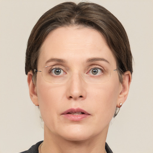 Neutral white adult female with short  brown hair and grey eyes