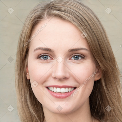 Joyful white young-adult female with long  brown hair and green eyes