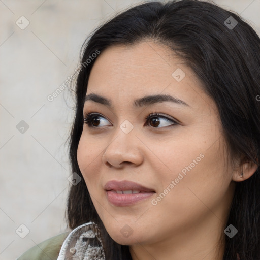 Joyful asian young-adult female with long  brown hair and brown eyes